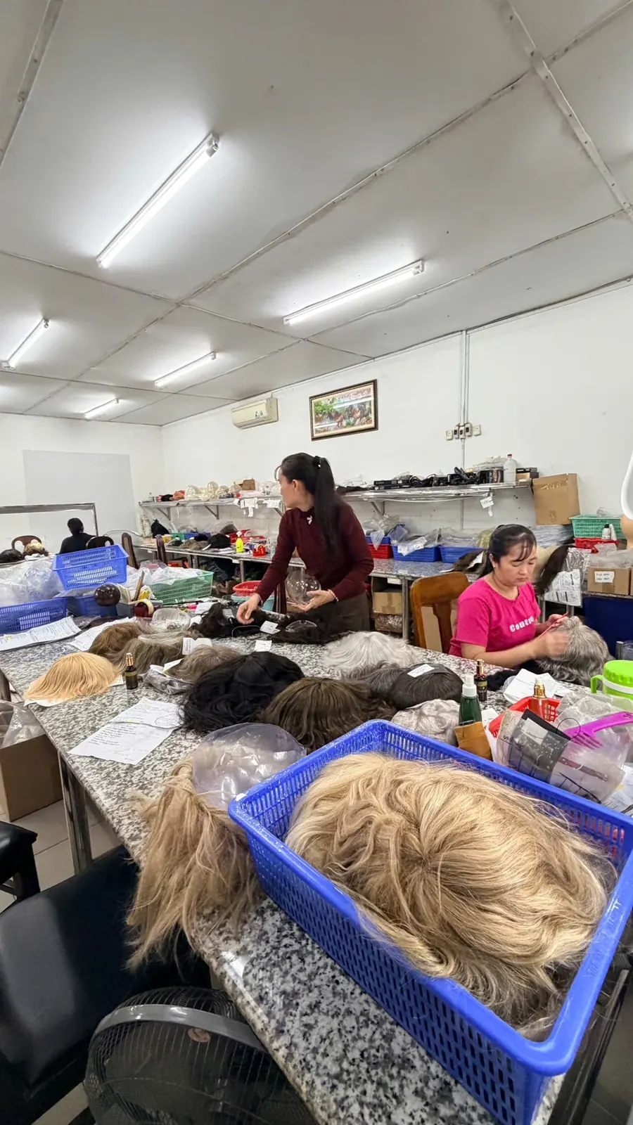 Hairpiece production work inside the Phuc Thien Toupee workshop